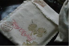 Stitched linen bags, rubber stamps, branches, mail collection stamps.
