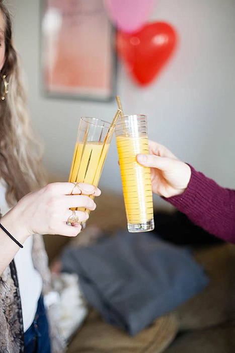 toasting with mimosas