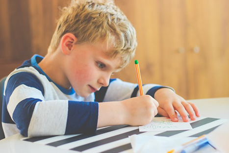 a boy writing